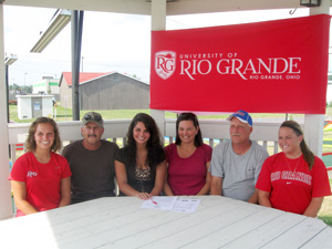Northridge High standout Kimber Hazlett poses with family and coaches after signing to play softball at Rio Grande